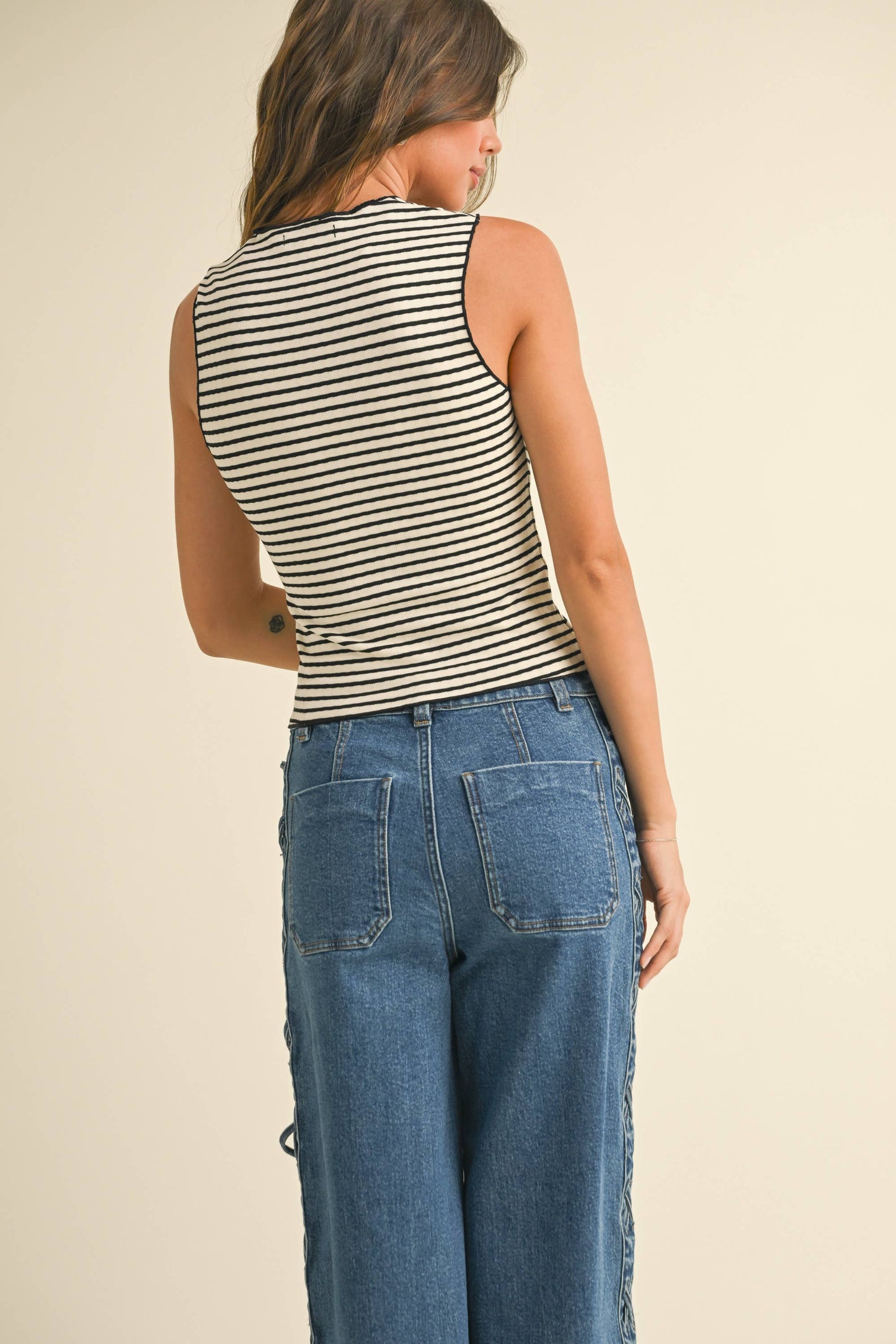 STRIPED KNITTED TOP WITH MERROW END